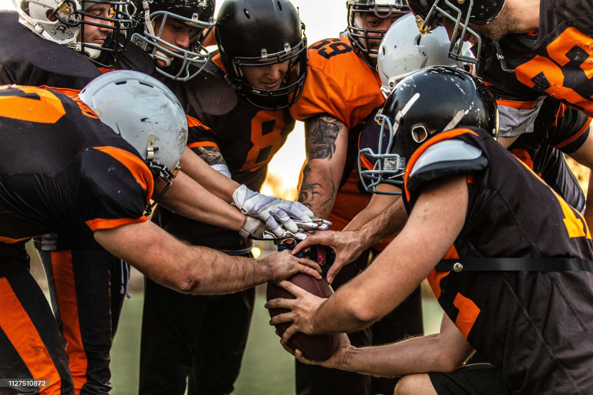 American Football Players Starting Match At Stadium, high angle view